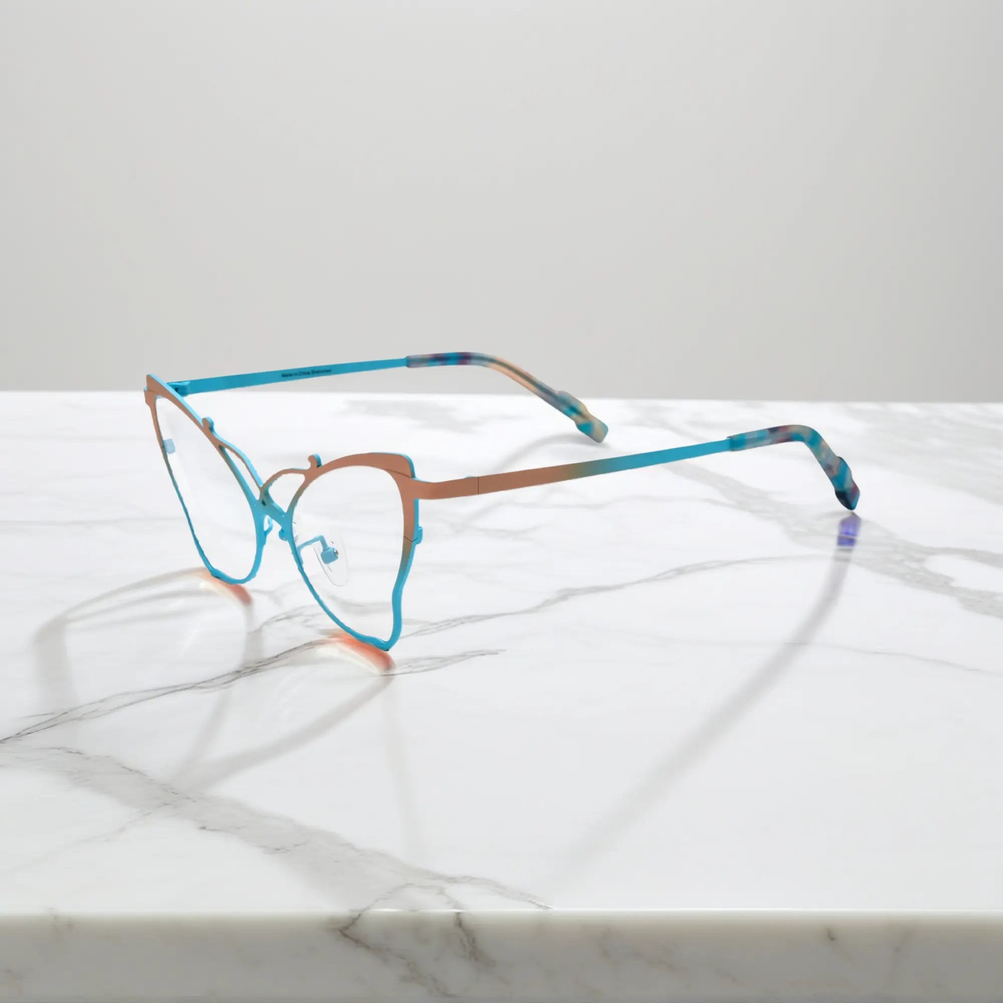 Side of VoyueLens™ VL185862 titanium butterfly eyeglasses in Yellow Blue – a lightweight, colorful, vintage-inspired, prescription ready frame designed for unique artistic style and everyday comfort.
